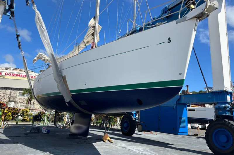 Magique 2 Yacht Photos Pics 2005 Beneteau Oceanis 523 sailboat in dry dock, undergoing maintenance.