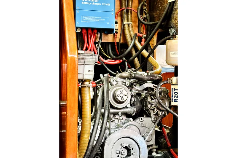 Magique 2 Yacht Photos Pics Engine compartment of 2005 Beneteau Oceanis 523 sailboat, featuring battery charger and wiring.