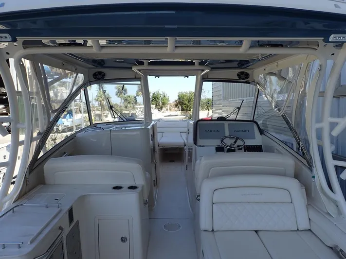  Yacht Photos Pics 2021 Grady-White Freedom 325 boat interior with dual helm seats and spacious cockpit.