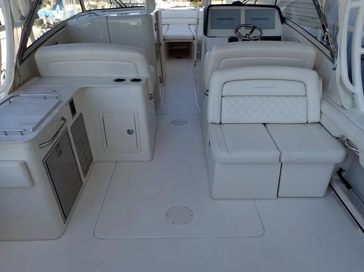  Yacht Photos Pics 2021 Grady-White Freedom 325 boat interior with seating and navigation equipment.