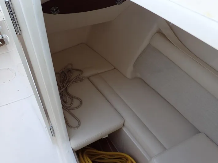  Yacht Photos Pics 2021 Grady-White Freedom 325 boat interior with seating and storage area.