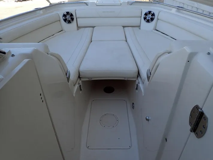  Yacht Photos Pics 2021 Grady-White Freedom 325 boat interior with white seating and speakers.