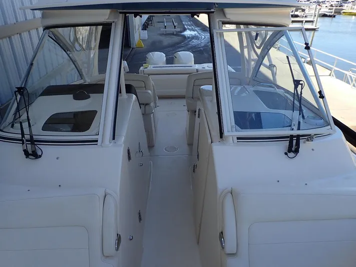  Yacht Photos Pics 2021 Grady-White Freedom 325 boat interior, featuring dual consoles and spacious seating.