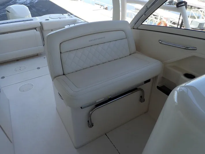  Yacht Photos Pics 2021 Grady-White Freedom 325 boat interior with white cushioned seating.