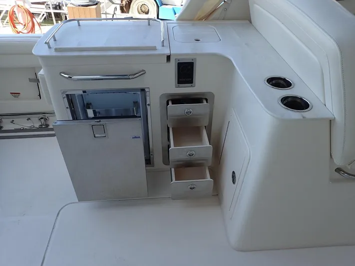  Yacht Photos Pics 2021 Grady-White Freedom 325 boat interior with storage drawers and cup holders.