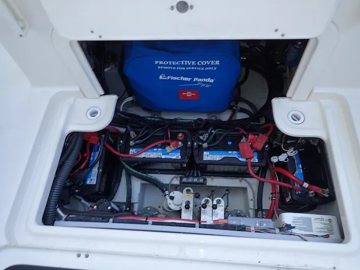  Yacht Photos Pics Engine compartment of 2021 Grady-White Freedom 325 with batteries and protective cover.