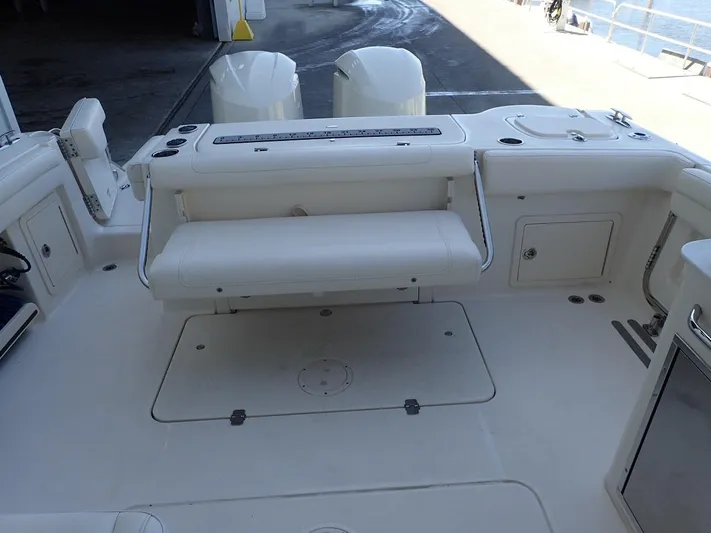  Yacht Photos Pics 2021 Grady-White Freedom 325 boat interior with seating and storage compartments.