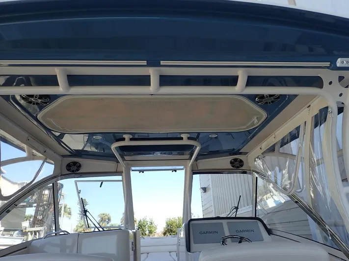  Yacht Photos Pics 2021 Grady-White Freedom 325 boat interior with Garmin electronics and sleek design.