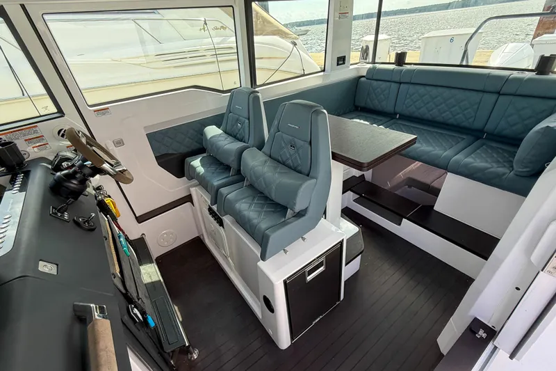 Maverick Yacht Photos Pics Interior of 2023 Axopar 37 XC AFT CABIN with seating and helm station.