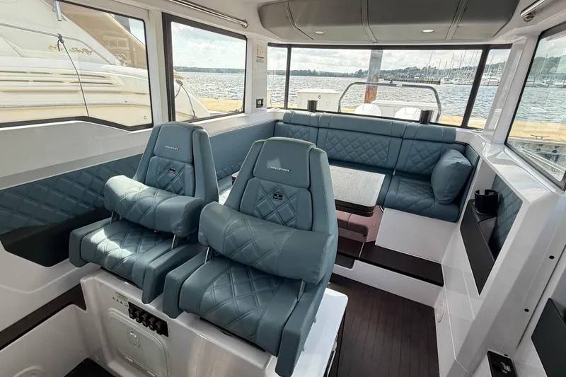 Maverick Yacht Photos Pics Interior of 2023 Axopar 37 XC AFT CABIN with luxurious seating and panoramic windows.