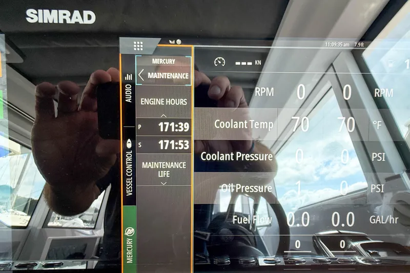 Maverick Yacht Photos Pics Simrad display on 2023 Axopar 37 XC AFT CABIN showing engine and maintenance data.