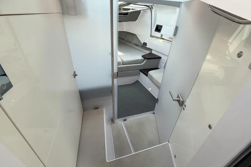 Maverick Yacht Photos Pics 2023 Axopar 37 XC AFT CABIN interior with modern seating and sleek design.