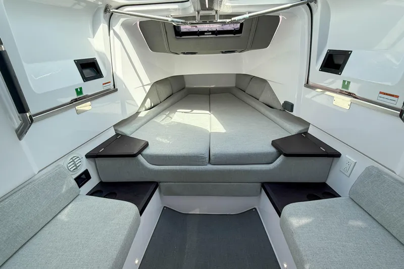 Maverick Yacht Photos Pics 2023 Axopar 37 XC AFT CABIN interior with modern seating and sleek design.