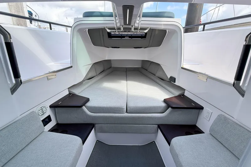Maverick Yacht Photos Pics 2023 Axopar 37 XC AFT CABIN interior with modern seating and sleek design.