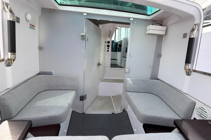 Maverick Yacht Photos Pics 2023 Axopar 37 XC AFT CABIN interior with modern seating and sleek design.