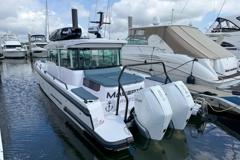 Maverick Yacht Photos Pics 2023 Axopar 37 XC AFT CABIN boat docked with twin Mercury engines.