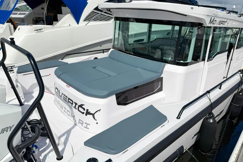Maverick Yacht Photos Pics 2023 Axopar 37 XC AFT CABIN boat docked, featuring sleek design and modern cabin.