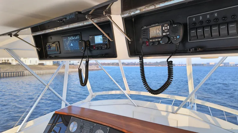  Yacht Photos Pics 1998 Viking 47 Convertible yacht helm with navigation equipment and ocean view.