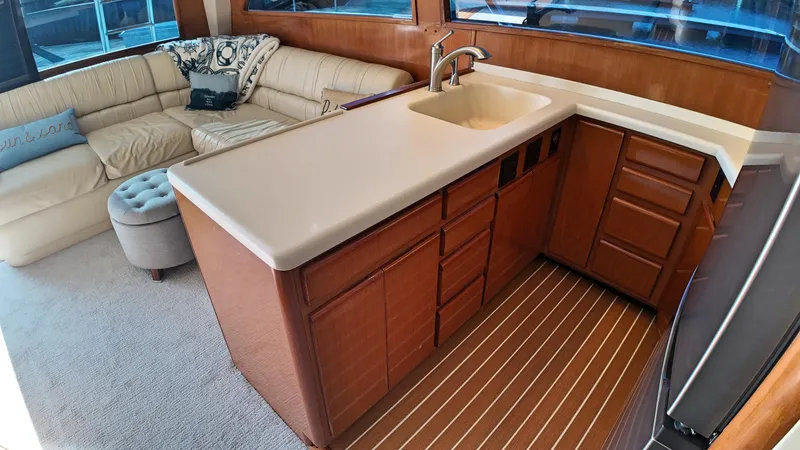  Yacht Photos Pics Interior of 1998 Viking 47 Convertible yacht with kitchen and seating area.