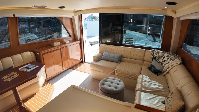  Yacht Photos Pics Interior of 1998 Viking 47 Convertible yacht with beige seating and wooden accents.