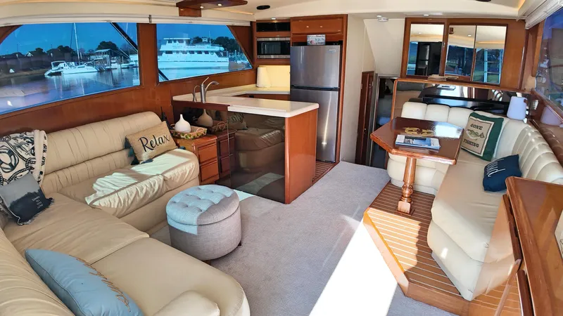  Yacht Photos Pics Luxurious interior of a 1998 Viking 47 Convertible yacht with plush seating and modern amenities.