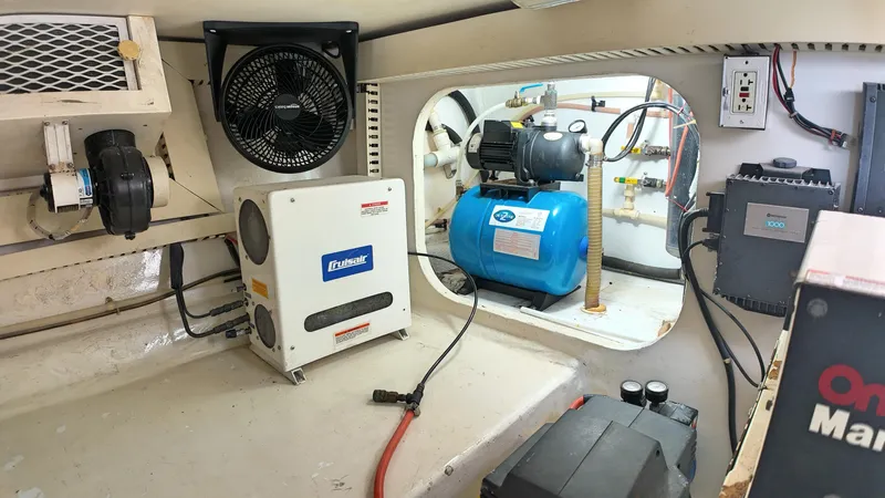  Yacht Photos Pics Engine room of 1998 Viking 47 Convertible with various equipment and wiring.