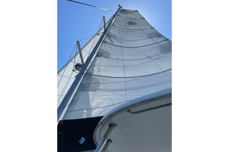  Yacht Photos Pics Sailing yacht Lagoon 450, 2019 model, with sails unfurled against a clear blue sky.