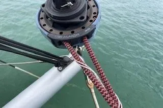  Yacht Photos Pics Close-up of a 2019 Lagoon 450 sailboat rigging over water.