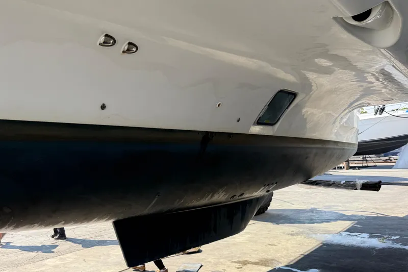  Yacht Photos Pics Close-up of a 2019 Lagoon 450 catamaran hull in a boatyard.