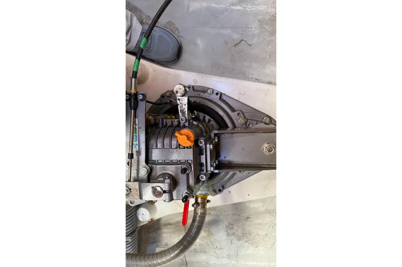  Yacht Photos Pics Engine component of a 2019 Lagoon 450 catamaran, featuring mechanical parts and hoses.