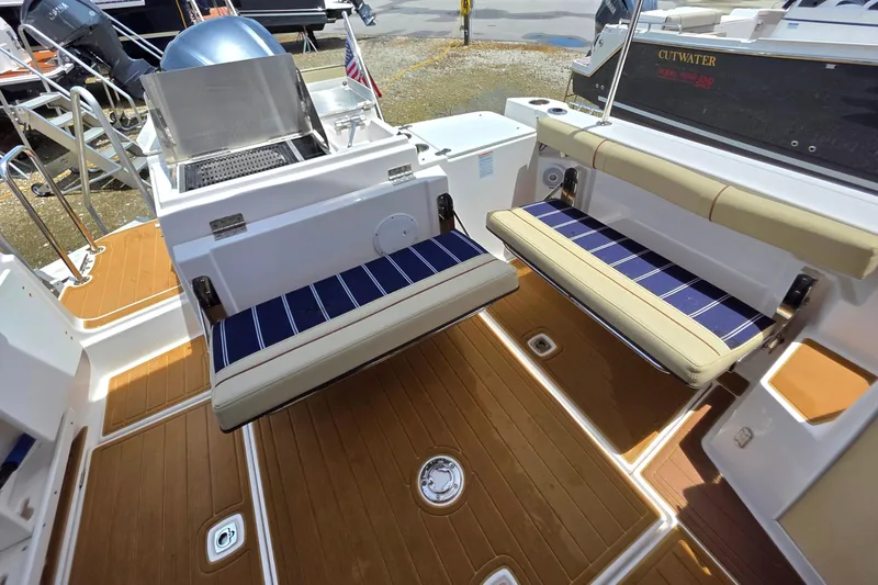 Seamore Yacht Photos Pics 2020 Ranger Tugs R27LE boat deck with foldable seating and grill.