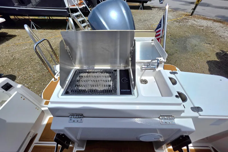 Seamore Yacht Photos Pics Outdoor kitchen on 2020 Ranger Tugs R27LE boat with grill and sink.