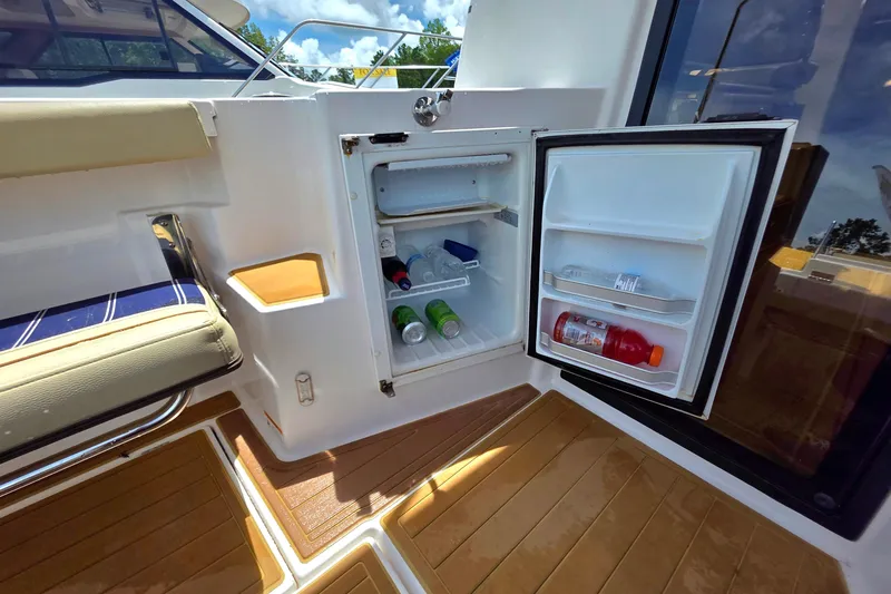 Seamore Yacht Photos Pics 2020 Ranger Tugs R27LE boat with open mini fridge, stocked with drinks.