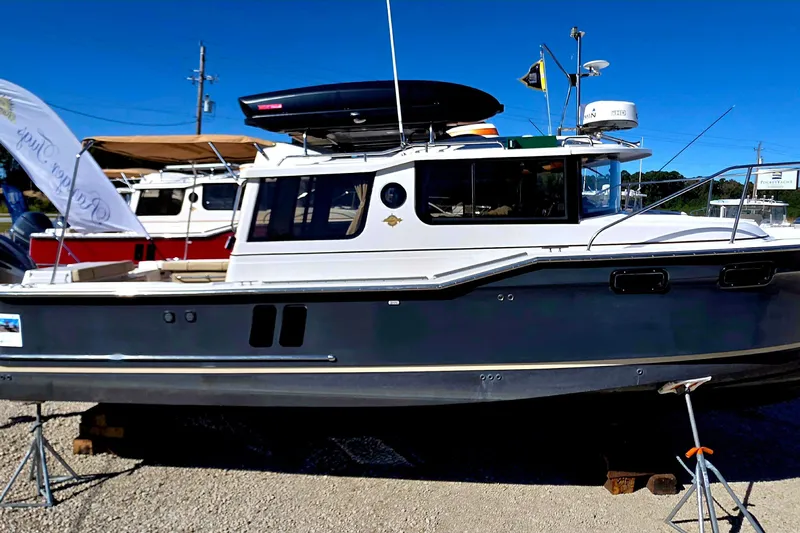 Seamore Yacht Photos Pics 2020 Ranger Tugs R27LE boat displayed outdoors on a sunny day.