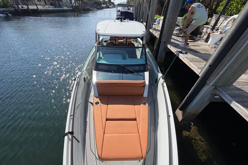  Yacht Photos Pics 2024 Saxdor 320 GTO docked, featuring sleek design and orange seating.