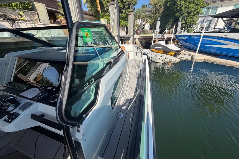  Yacht Photos Pics 2024 Saxdor 320 GTO docked, showcasing sleek design and modern features.