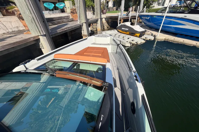  Yacht Photos Pics 2024 Saxdor 320 GTO boat docked, showcasing sleek design and modern features.