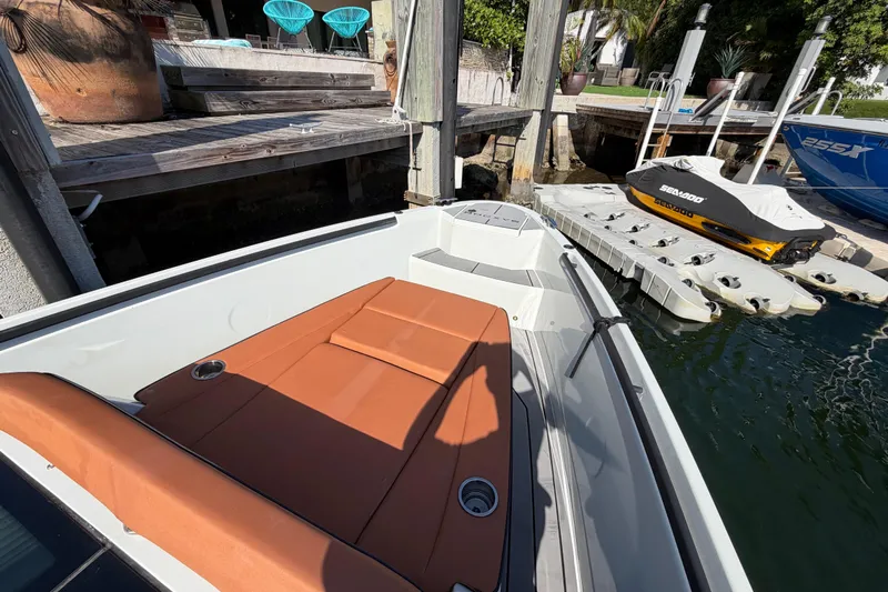  Yacht Photos Pics 2024 Saxdor 320 GTO boat docked, featuring a sleek design and comfortable seating.