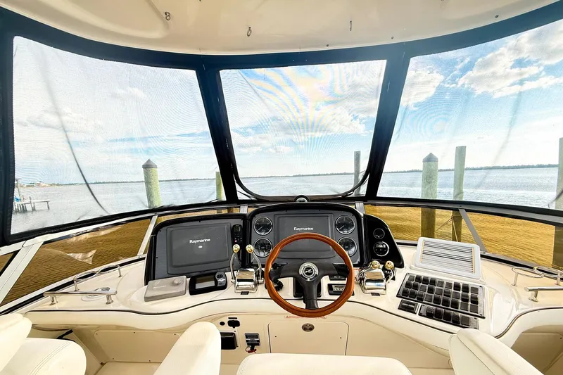 Shell’s Island II Yacht Photos Pics 2008 Sea Ray 44 Sedan Bridge helm with panoramic water view and modern navigation equipment.