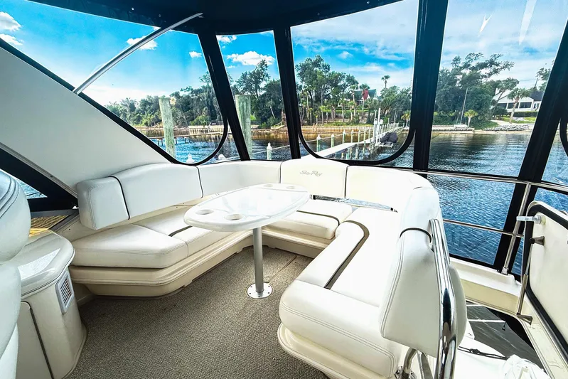 Shell’s Island II Yacht Photos Pics Luxurious interior of 2008 Sea Ray 44 Sedan Bridge yacht with waterfront view.