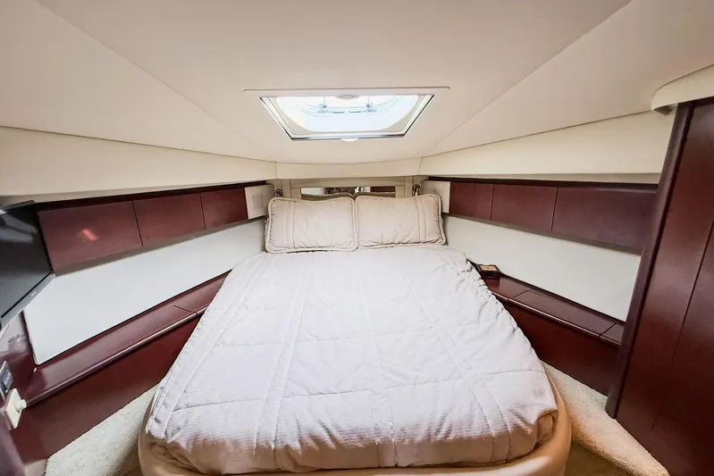 Shell’s Island II Yacht Photos Pics Luxurious bedroom interior of 2008 Sea Ray 44 Sedan Bridge yacht with skylight.