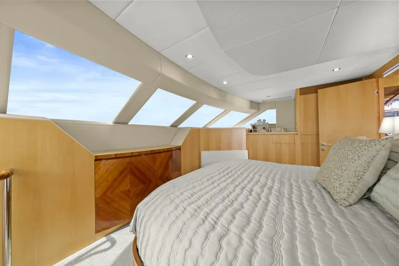 Tranquility Yacht Photos Pics Luxurious bedroom interior of 2013 Horizon PC60 yacht with modern design and large windows.