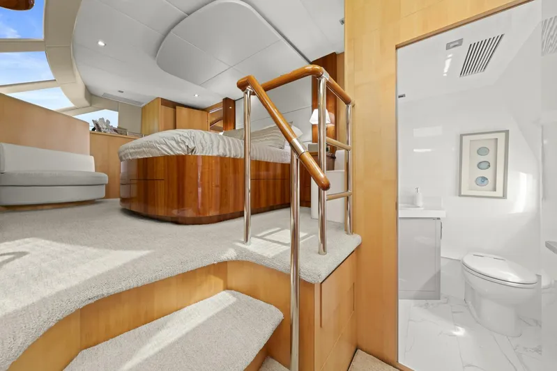 Tranquility Yacht Photos Pics Luxurious interior of 2013 Horizon PC60 yacht with modern bedroom and bathroom.