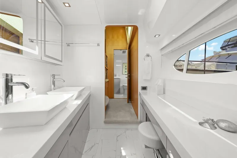 Tranquility Yacht Photos Pics Luxurious bathroom interior on 2013 Horizon PC60 yacht, featuring modern fixtures and elegant design.