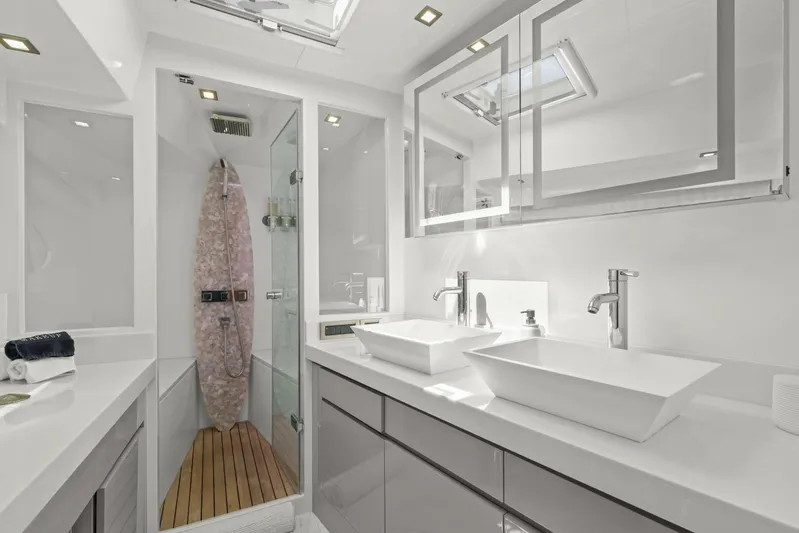 Tranquility Yacht Photos Pics Luxurious bathroom in 2013 Horizon PC60 yacht with modern fixtures and glass shower.