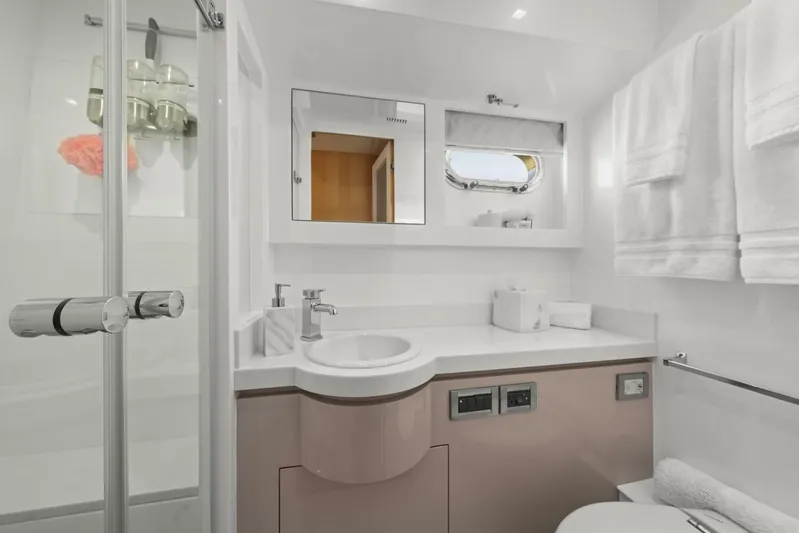 Tranquility Yacht Photos Pics Modern bathroom in 2013 Horizon PC60 yacht with shower, sink, and towels.