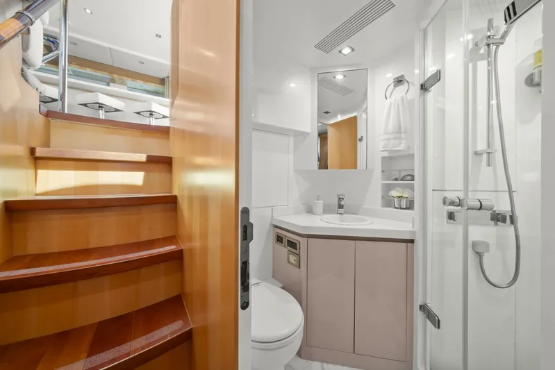 Tranquility Yacht Photos Pics Luxurious bathroom in 2013 Horizon PC60 yacht with wooden stairs and modern fixtures.