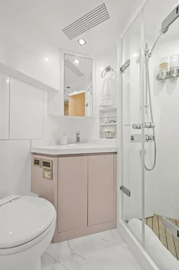 Tranquility Yacht Photos Pics Modern yacht bathroom with shower, sleek cabinetry, and elegant fixtures in a Horizon PC60, 2013 model.