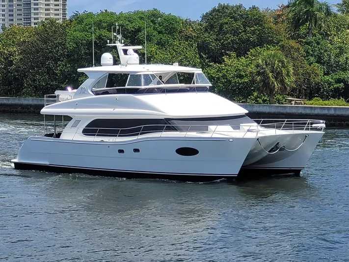 Tranquility Yacht Photos Pics Luxurious 2013 Horizon PC60 yacht cruising on a serene waterway.