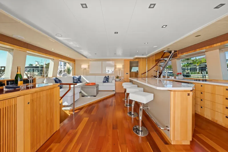 Tranquility Yacht Photos Pics Luxurious interior of 2013 Horizon PC60 yacht with modern furnishings and wooden flooring.